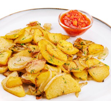 fried potatoes with onions with parsley and sauce