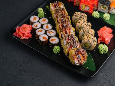 set of colorful different kinds of sushi rolls