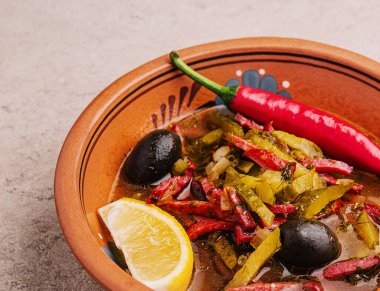 meat soup Solyanka in bowl close up