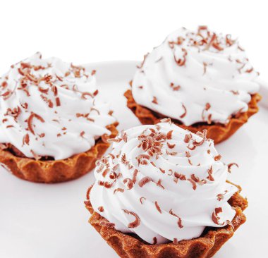 Small chocolate tarts with whipped cream