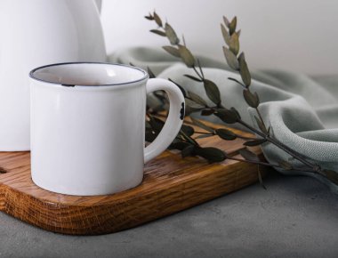 vintage metal teapot and mug with tea