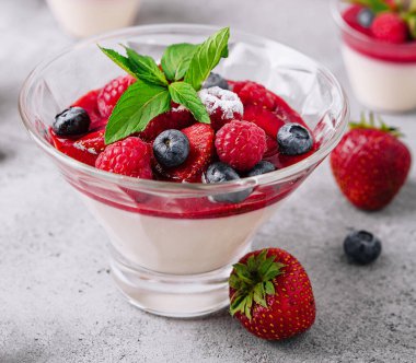 Italian dairy dessert panna cotta with raspberry jam