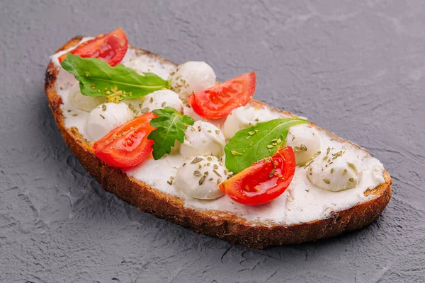 Caprese bruschetta toasts with cherry tomatoes