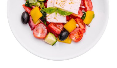 Greek salad of organic vegetables with tomatoes, cucumber, red onion, olives