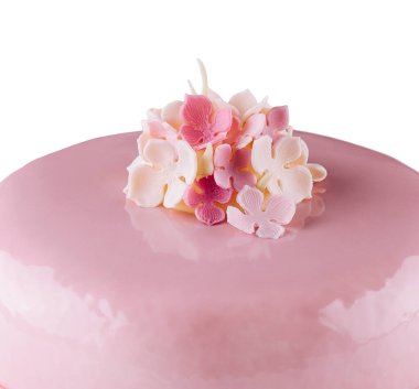 Pink mousse cakes decorated on white plate