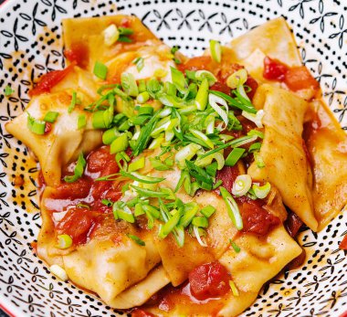 Fried dumplings gyoza with onions top view