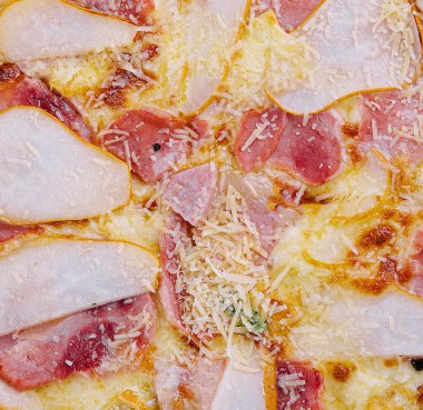 Delicious meat pizza with salami, ham and cheese