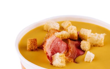 savory creamy pumpkin soup topped with fried bacon