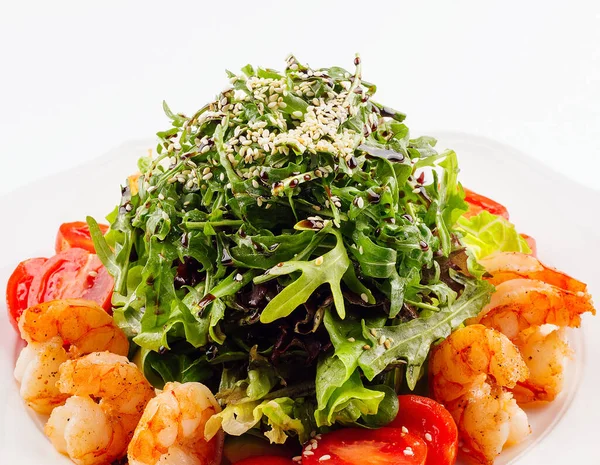 stock image Healthy arugula salad bowl with shrimp, tomato, and sesame seeds