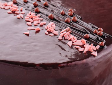 cake on white plate with topping chocolate