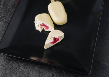 dessert from ice cream lolly with white chocolate coating