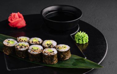 Sushi Maki With Avocado on black plate