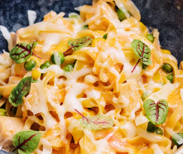 pasta with salmon and peas with wine glass