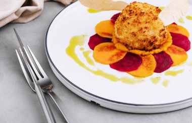 breaded cutlet with sweet potato and beets