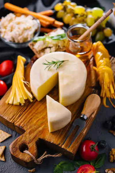 Cheese plate with variety of cheese top view
