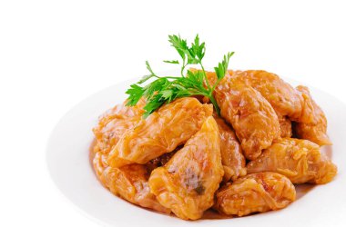 Cabbage rolls with rice and vegetables on plate