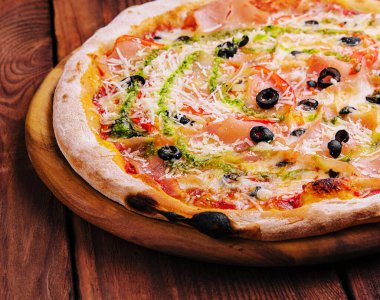 Pizza with cream cheese sauce on wood