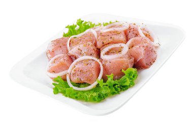 Raw pork meat with onions and spices for cooking kebabs