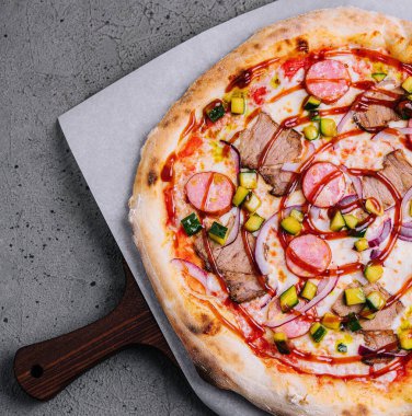 Barbecue pizza with cheese and tomato sauces