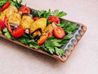 Rolls of eggplant with cheese, pepper and dill