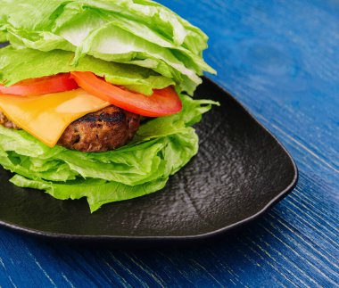 Healthy hamburger wrapped in lettuce