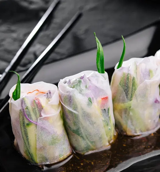 Vietnamese spring rolls on black plate