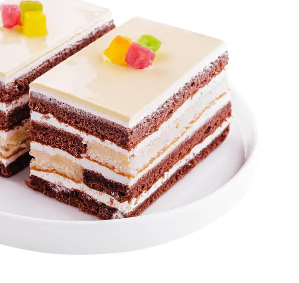 Delicious multilayer cocoa sponge cake with sugar mass