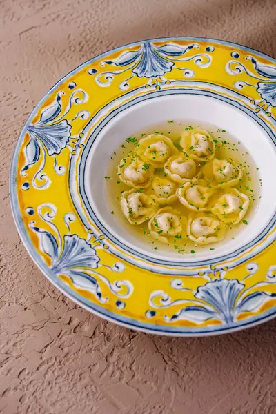 Elegant Ceramic Plate Traditional Italian Tortellini Sprinkled Herbs Textured Background — Stock Photo, Image