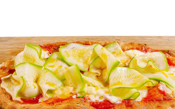 stock image Gourmet zucchini pizza with zucchini and cheese toppings, served on a cutting board against a white background