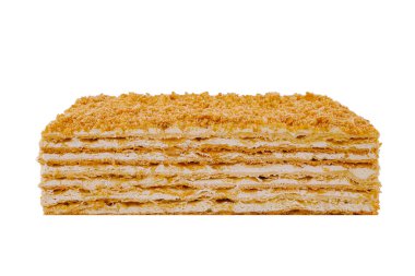 Ağız sulandıran Napolyon keki, beyaz bir arka planda duruyor, çeşitli katmanlı hamur işi ve kremalı dolguyu sergiliyor.