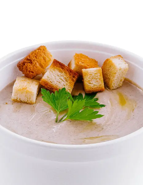 stock image Mushroom cream soup is served in a to-go cup and garnished with croutons and parsley