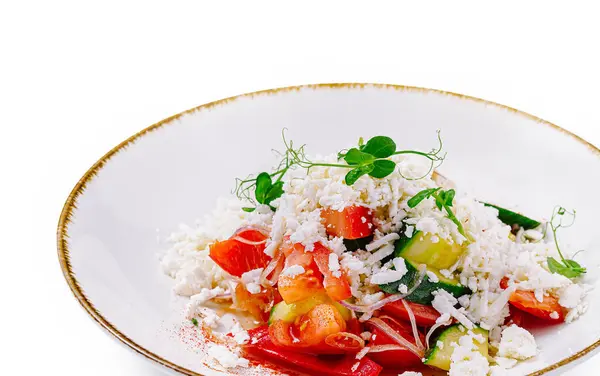 stock image Shopska salad is made with tomatoes, cucumbers, peppers, sirene cheese, and parsley