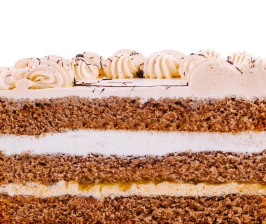 Lezzetli pasta, çok katmanlı pasta ve tereyağlı krema tabakasını gösteriyor.