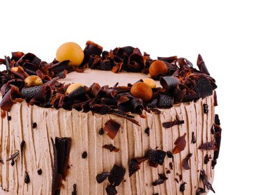 Çikolata kıvırcık ve şekerle süslenmiş ağız sulandıran çikolatalı pasta, her tatlı aşığını baştan çıkarır.