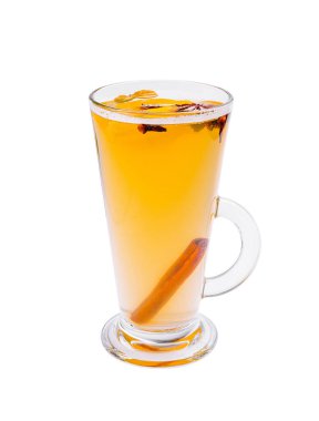 A warm spiced drink featuring vibrant yellow-orange liquid, decorated with cinnamon and cloves, is served in a clear glass cup against a plain white background. clipart