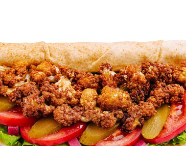 A delicious wrap filled with crispy fried cauliflower, fresh lettuce, sliced tomatoes, and pickles, all nestled in a soft tortilla, ready to be enjoyed at lunch. clipart