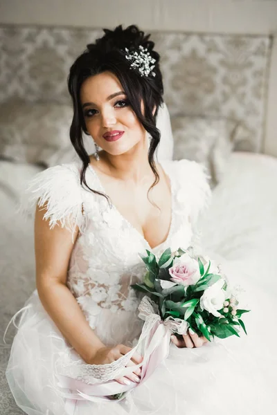 Portrait of a beautiful fashion bride, sweet and sensual. Wedding make up and hair.