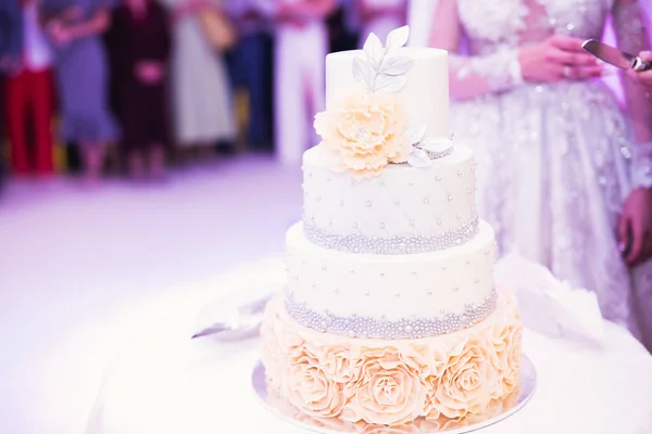 Luxury decorated wedding cake on the table.