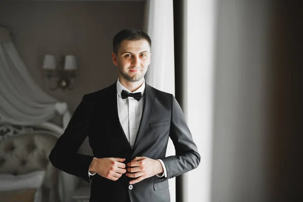 stock image Young handsome man relaxing at his apartment in a hotel after business meeting.