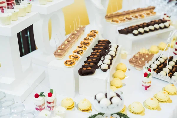 stock image Delicious wedding reception candy bar dessert table.