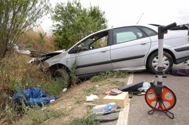 Front of a car collided with an embankment after suffering a traffic accident on the highway.