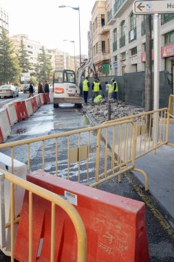 Repair works on a downtown sidewalk due to a broken water pipe.