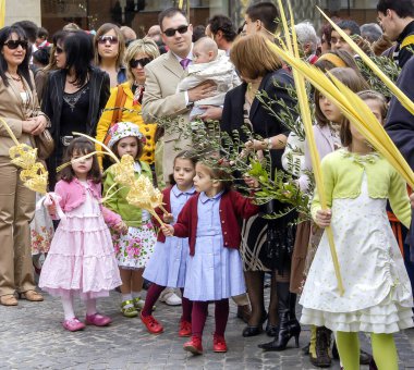 Girls with palms parading in the Holy Week Procession La Borriquita, Royal Brotherhood of Jesus in his Triumphal Entry into Jerusalem, on Palm Sunday in Zamora, Spain.