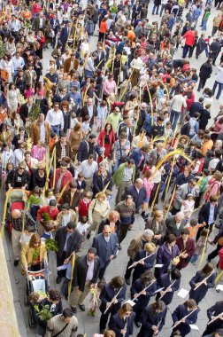 People with palms in the La Borriquita Holy Week procession, on Palm Sunday in Zamora, Spain.