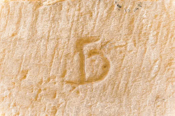 Masonry mark on a wall of the Monastery of Santa Mara de Moreruela, Zamora, Spain. Signature that stonemasons carved into the wall when building the well-known 12th century monastery.