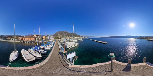 The port of Sal is a picturesque scene on a sunny winter day. The crystal clear water sparkles in the sunlight, creating a brilliant contrast with the deep blue sky.