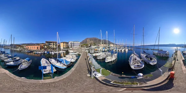 The port of Sal is a picturesque scene on a sunny winter day. The crystal clear water sparkles in the sunlight, creating a brilliant contrast with the deep blue sky.
