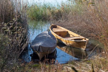 Eskikaraagac, Bursa - October 2022: Boats moored by the lake, among the reeds