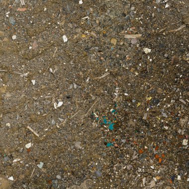 Grunge background texture of old dirty asphalt road with small pieces of broken glass