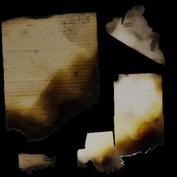 old paper with burnt edges on a black background with space for text
